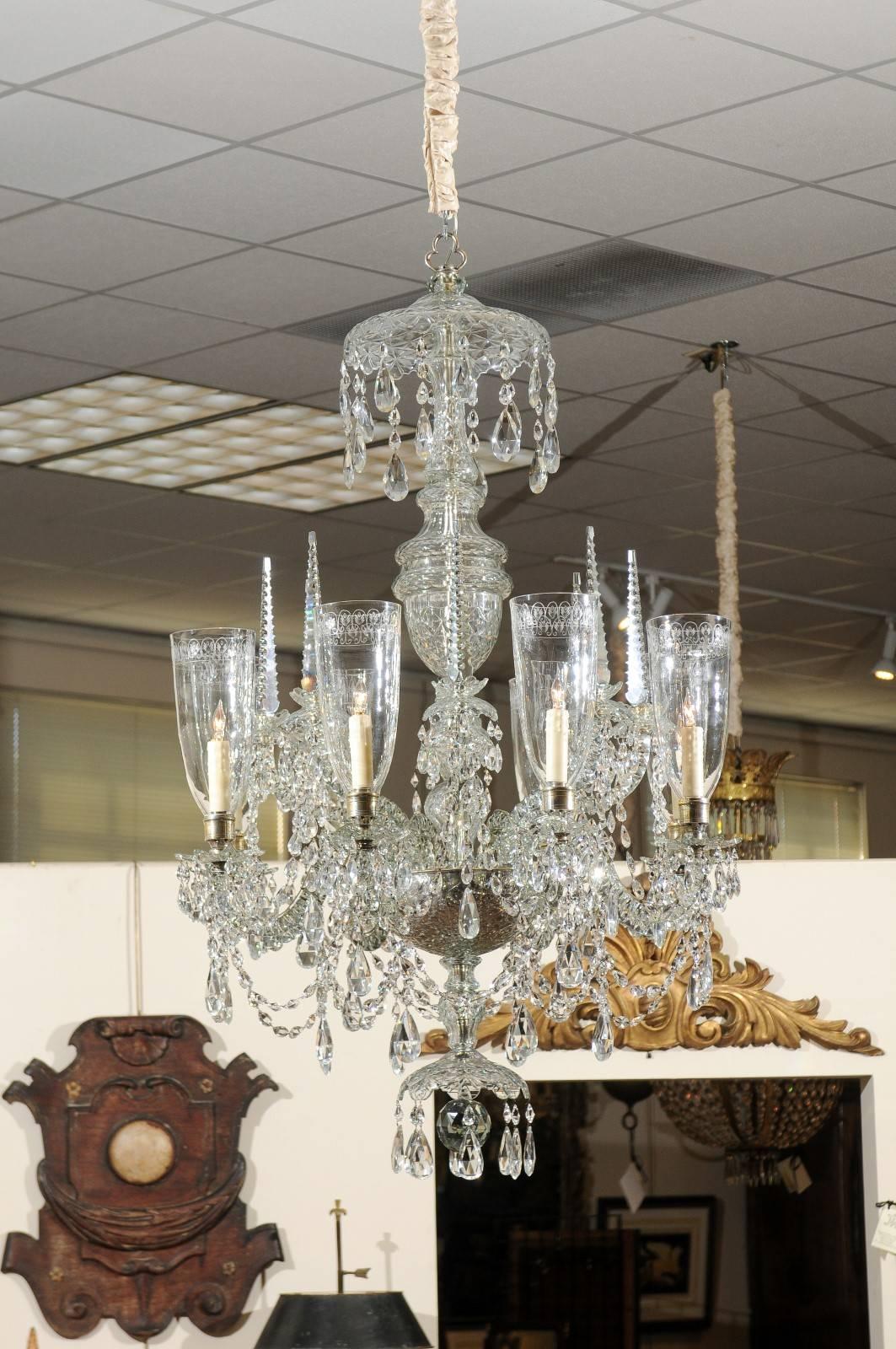Waterford crystal chandelier with eight (8) lights encased in etched crystal shades, spires, and drop prisms, Ireland mid-19th century.