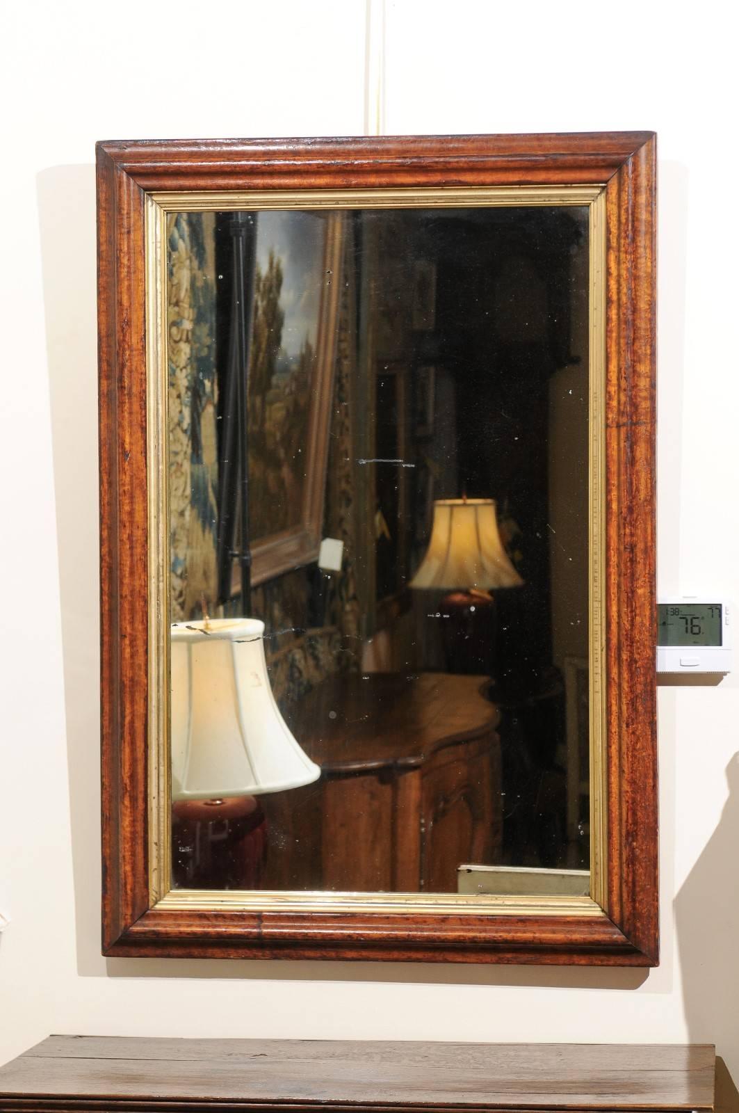 Large rectangular neoclassical style mirror in bird's-eye sycamore and parcel-gilt frame, Italy 19th century. Frame can be oriented vertically or horizontally.