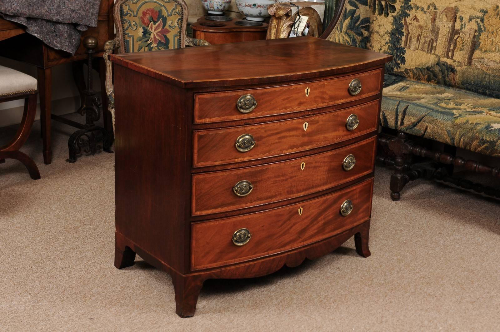 Mahogany Early 19th Century English Sheraton Bowfront Chest with Splay Feet For Sale