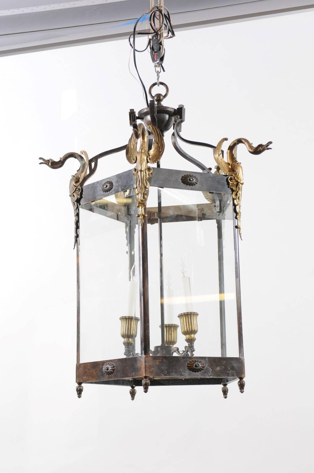 Empire style French large Hexagonal metal lantern with bronze swan mounts and three lights.