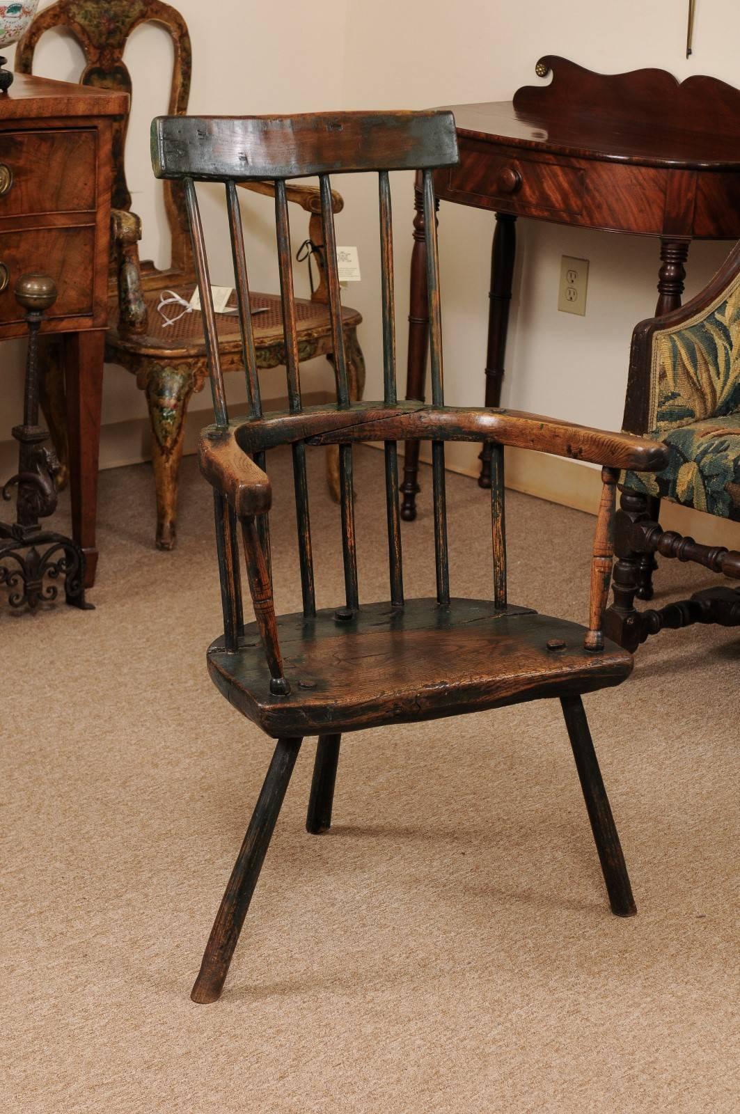 Primitive George III Windsor Chair in Ash with Rustic Green Painted Finish, Spindled Back, Curved Arms, Plank Seat, and Three (3) Splayed Legs, England circa 1800