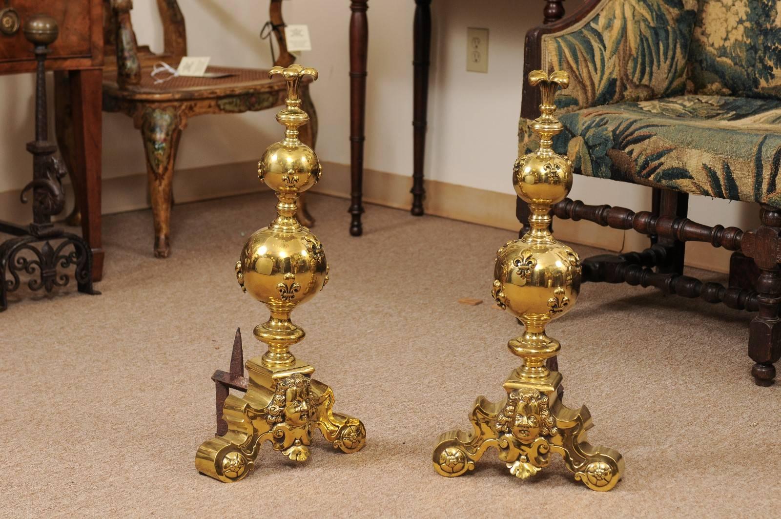 Pair of large 19th century brass andirons with Fleur di Lyes.