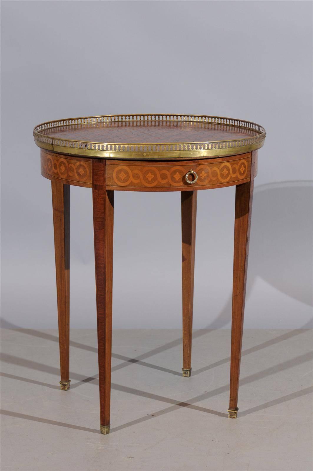 A Louis XVI style parquetry Inlaid Bouillotte table with brass gallery, drawer and tapered legs. 

To view our entire inventory, please visit our website.

William Word Fine Antiques: Atlanta's source for antique interiors since 1956.