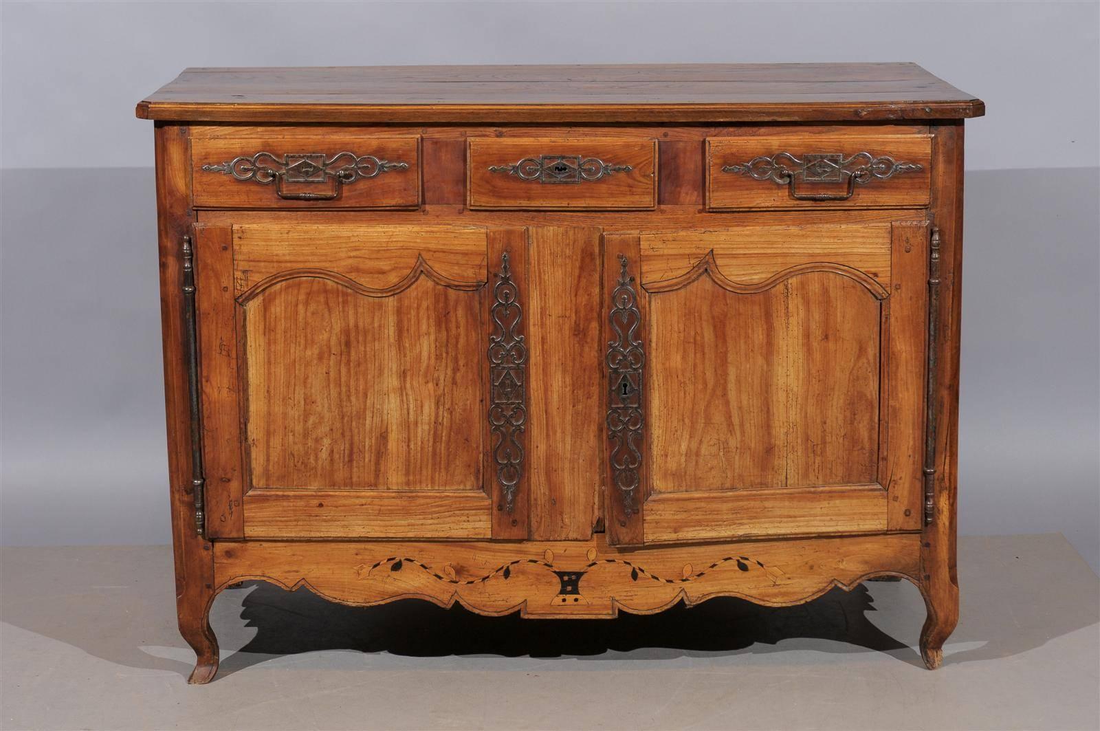A French Louis XV style fruitwood buffet with marquetry inlay on apron, circa 1820.