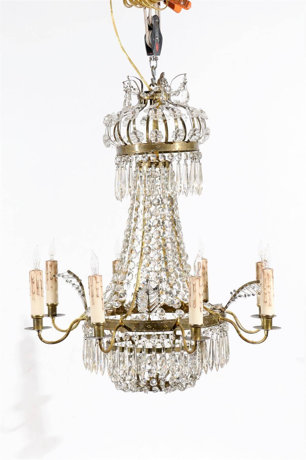 A petite swedish crystal and brass chandelier in basket form with 6 lights. 

William Word Fine Antiques: Atlanta's source for antique interiors since 1936.