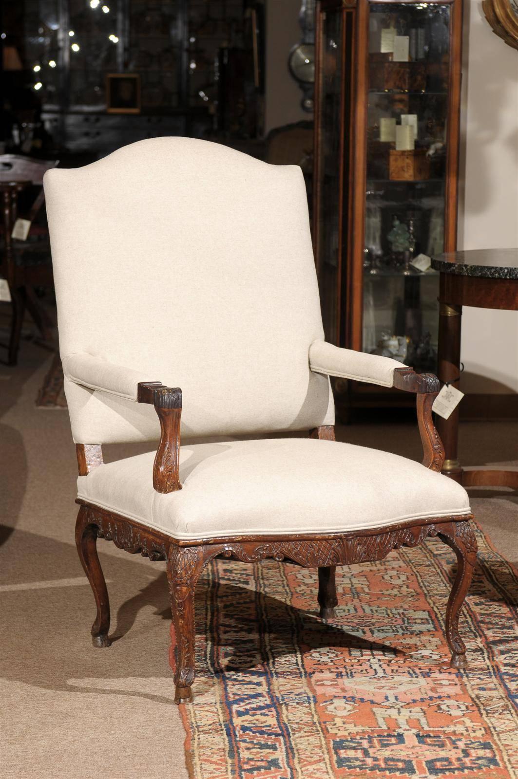 Large Regence period fauteuil with elaborate carving, France, circa 1720.