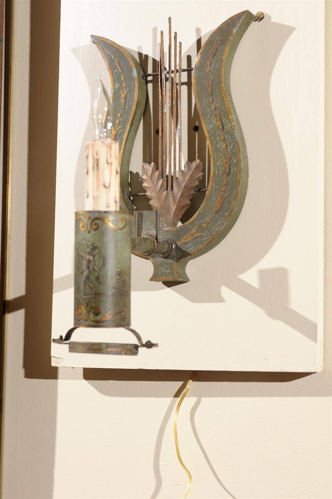 A pair of painted tole sconces with single light and lyre detail. 

To view our entire inventory, please visit our personal website. 

William Word Fine Antiques: Atlanta's source for antique interiors. 

 
