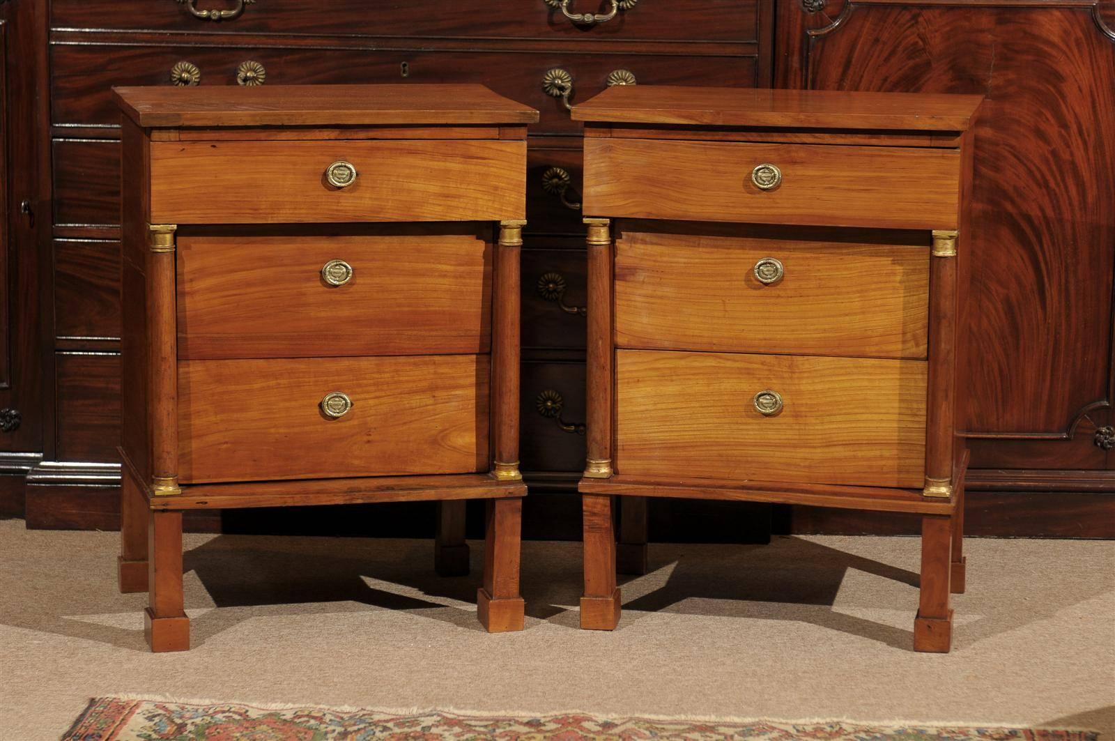Pair of Italian Fruitwood Empire Commodes with flanking columns, gold mounts and 3 drawers. 

To view all our inventory, please visit our personal website. 

William Word Fine Antiques: Atlanta's source for antique interiors since 1956. 