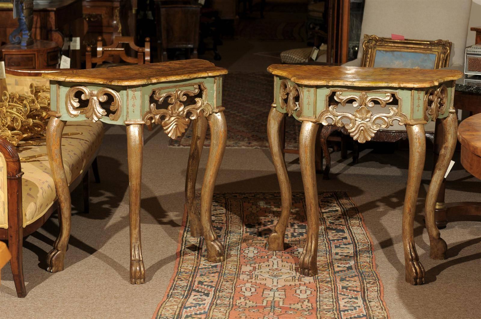 A pair of petite painted and polychrome consoles with faux marble tops, carved pierced apron and paw feet, Italy.



William Word Fine Antiques: Atlanta's source for antique interiors since 1956. 

 