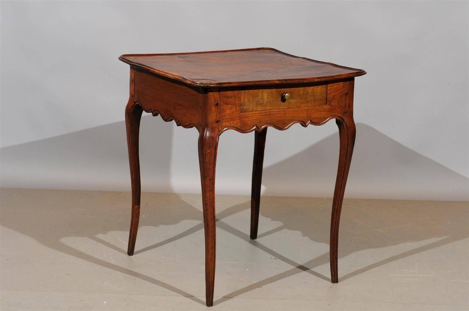 A Louis XV walnut square side table with drawer carved apron, cabriole legs and drawer.  

To view all our inventory, please visit our personal website. 

William Word Fine Antiques: Atlanta's source for antique interiors since 1956. 
