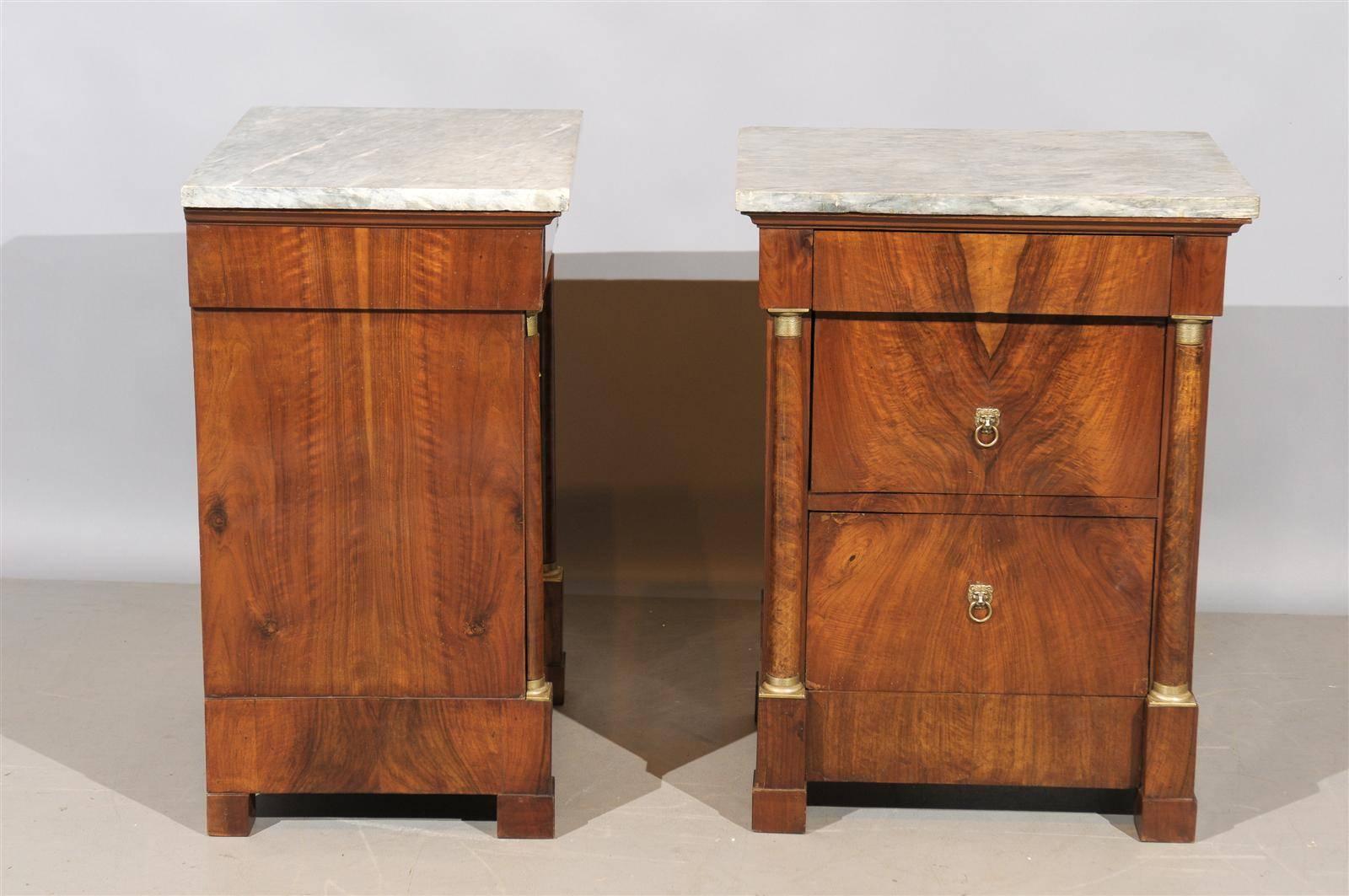A pair of bedside Empire walnut commodes with grey marble tops, 3 drawers and cabinets. 

