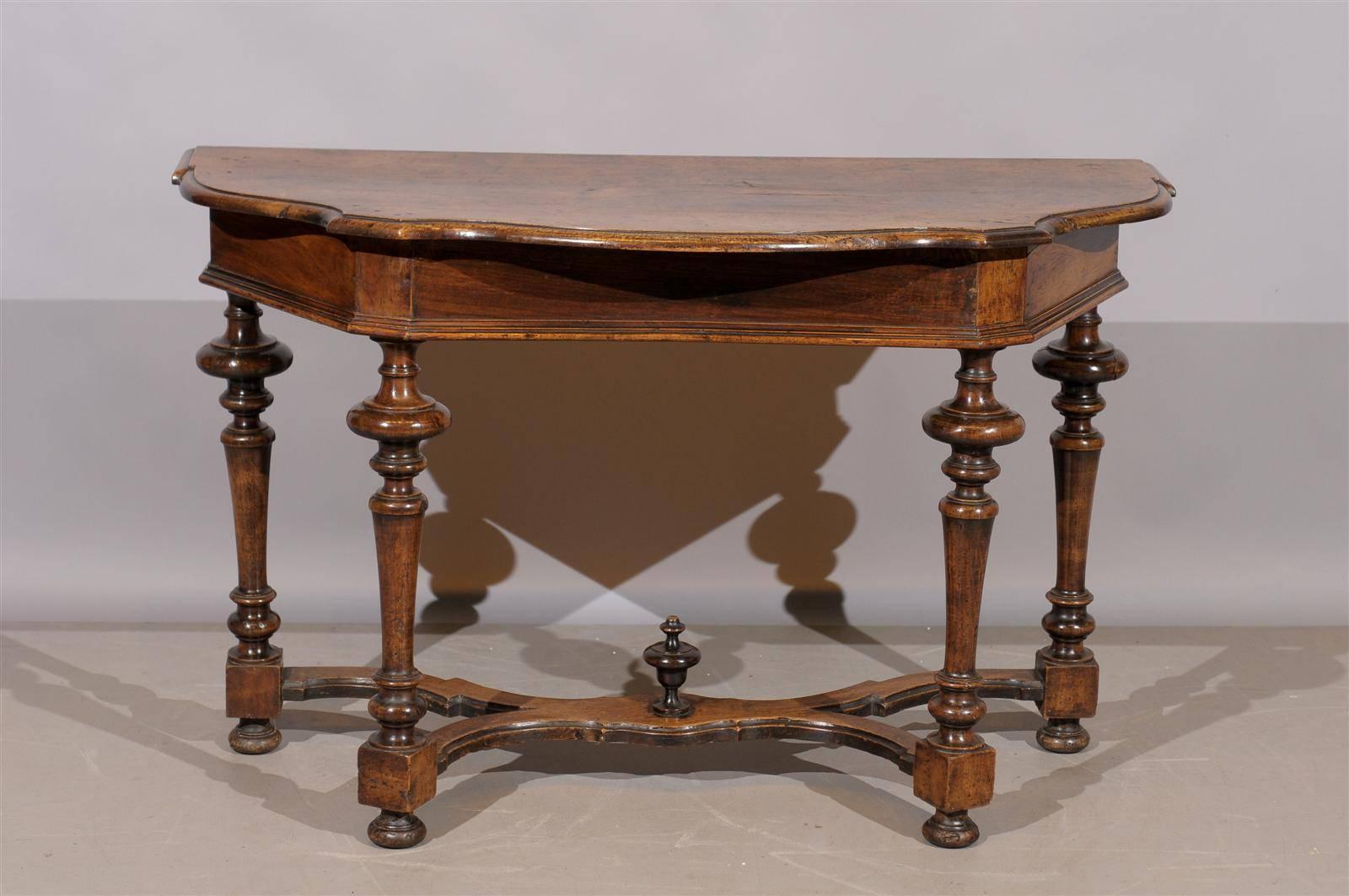 Tuscany walnut console table with serpentine front, x-stretcher and turned legs. 

To view our entire inventory, please visit our personal website. 

William Word Fine Antiques: Atlanta's source for antique interiors since 1956. 

  