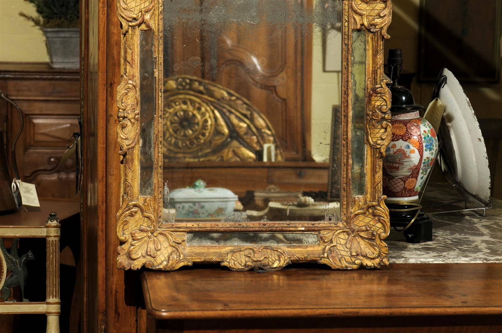 Early 18th Century French Giltwood Mirror with Flower Carving 2