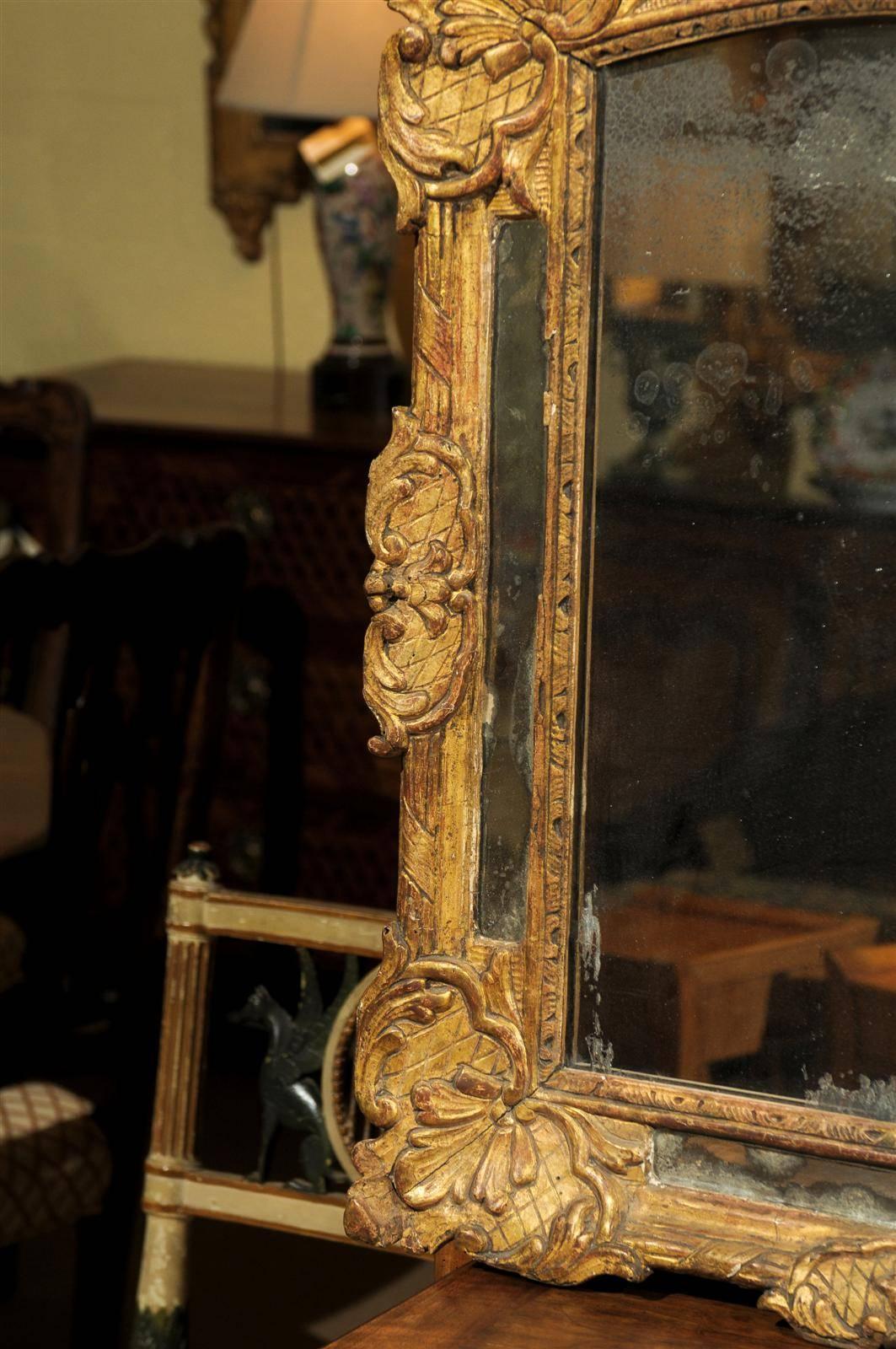 Early 18th Century French Giltwood Mirror with Flower Carving 1