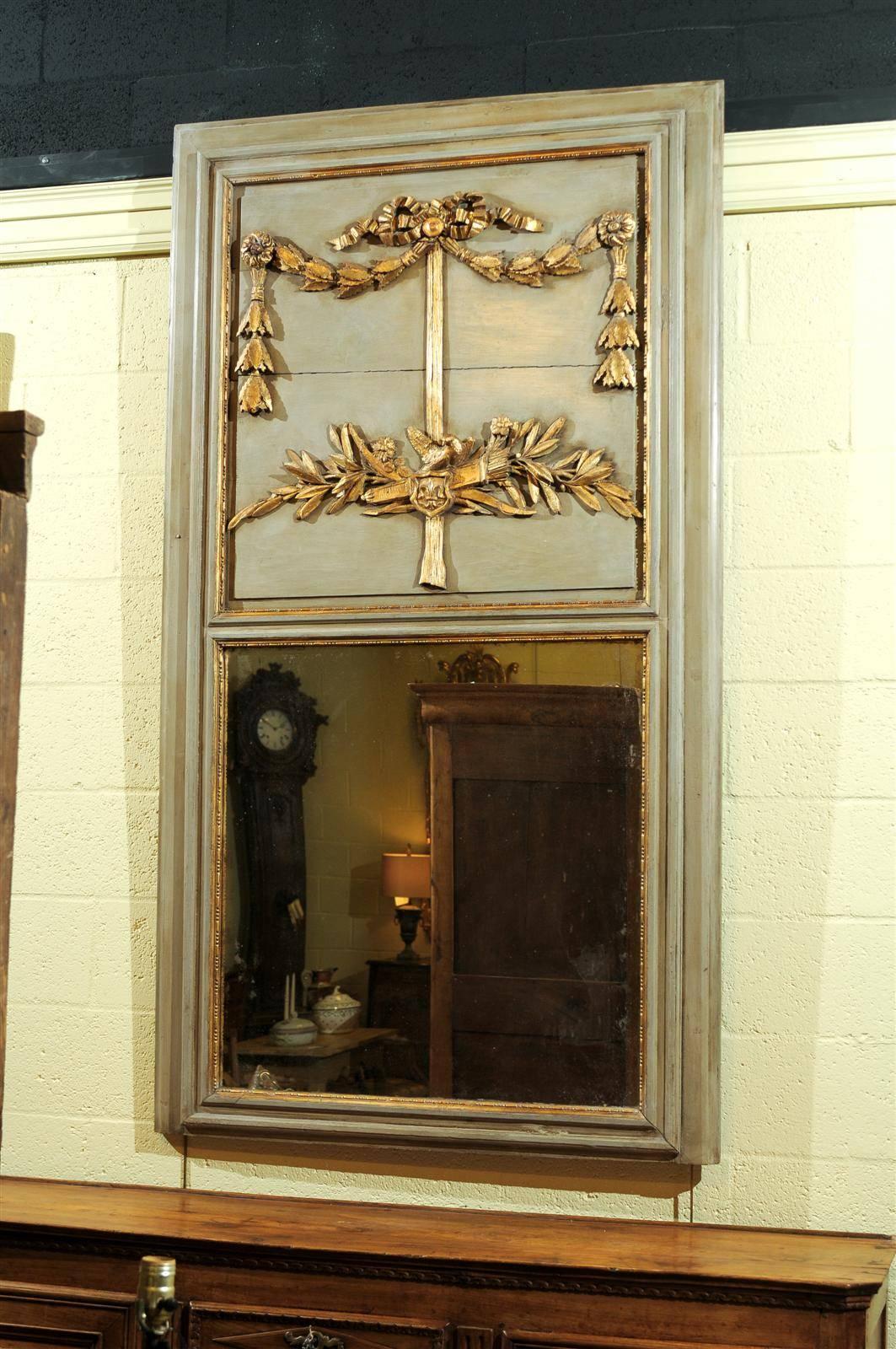 19th century French Louis XVI style green painted trumeau mirror with doves and laurel leaves.