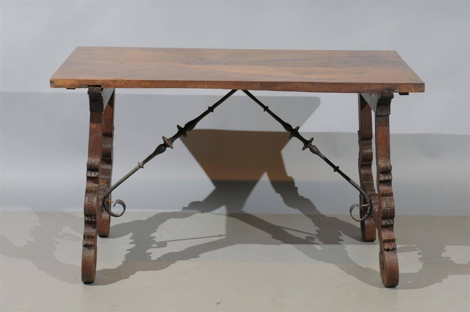 A 19th century walnut fratino table with carved shaped lyre legs and iron stretcher.

  

 

 


