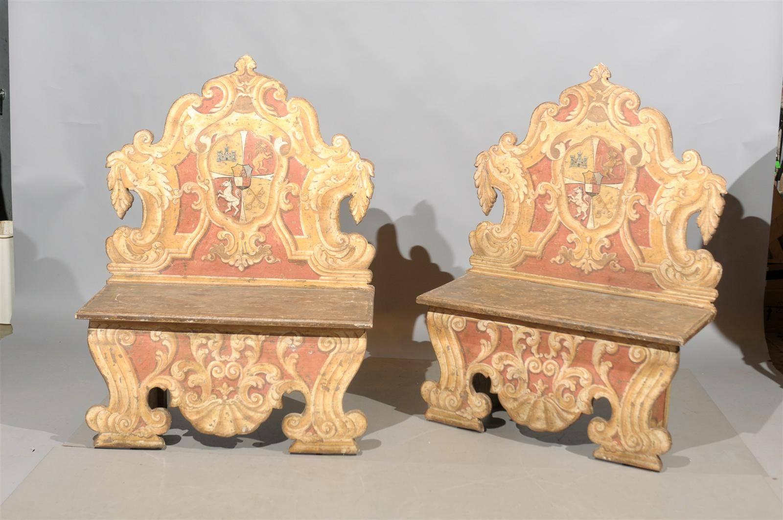 Pair of painted Italian benches with crests, Tuscany, 19th century.