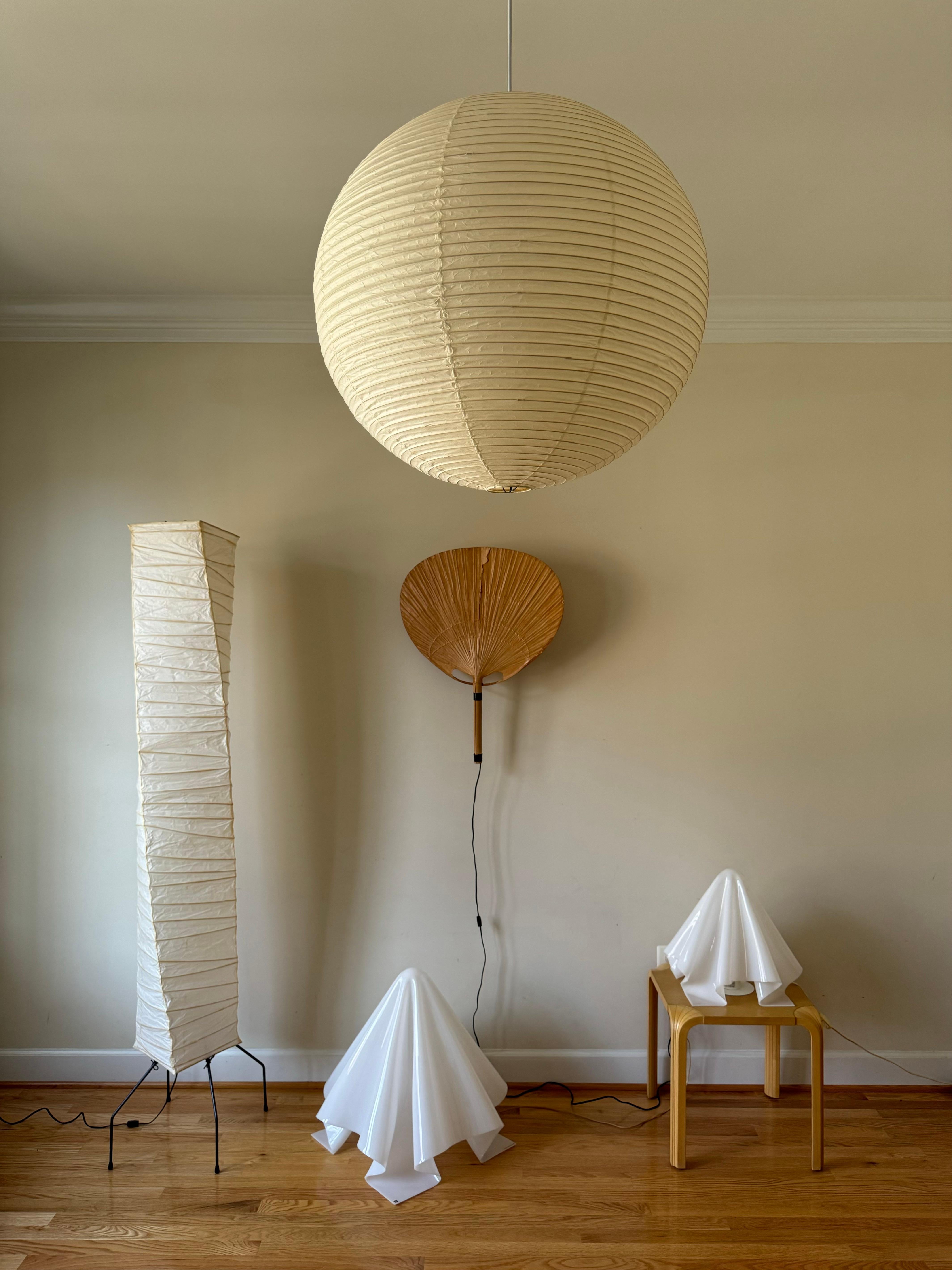 Akari Light Sculptures by Isamu Noguchi are considered icons of 1950s modern design. Designed by Noguchi beginning in 1951 and handmade for a half century by the original manufacturer in Gifu, Japan, the paper lanterns are a harmonious blend of