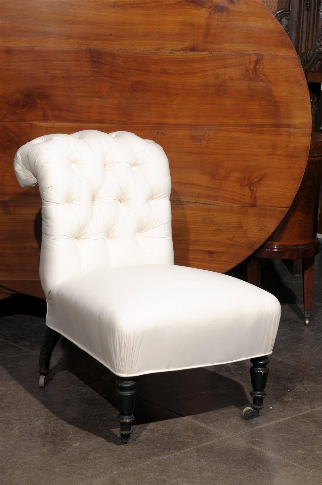 Unusual tufted English slipper chair with castors. New muslin upholstery.