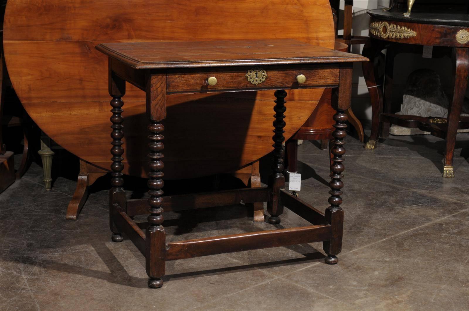 English oak bobbin leg table with single drawer.