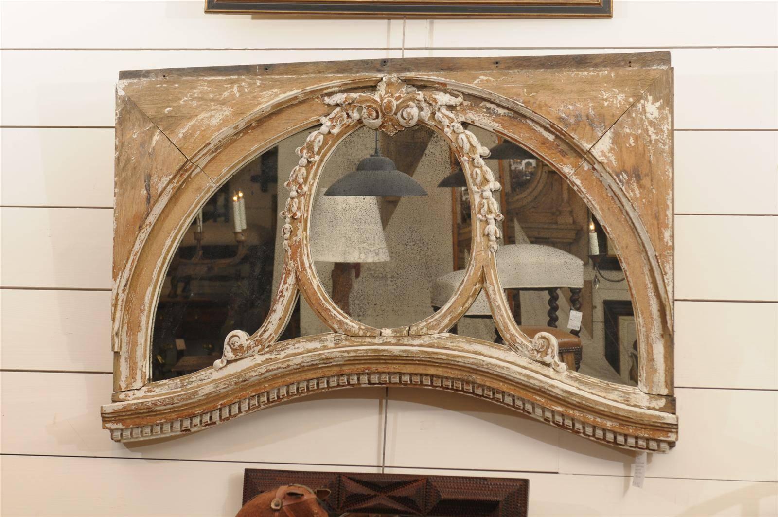 An exquisite pair of English painted wood architectural windows with new distressed mirrors. This pair of late 19th century architectural windows have been transformed into a beautiful pair of mirrors, with new distressed mirrors. The mirror on each
