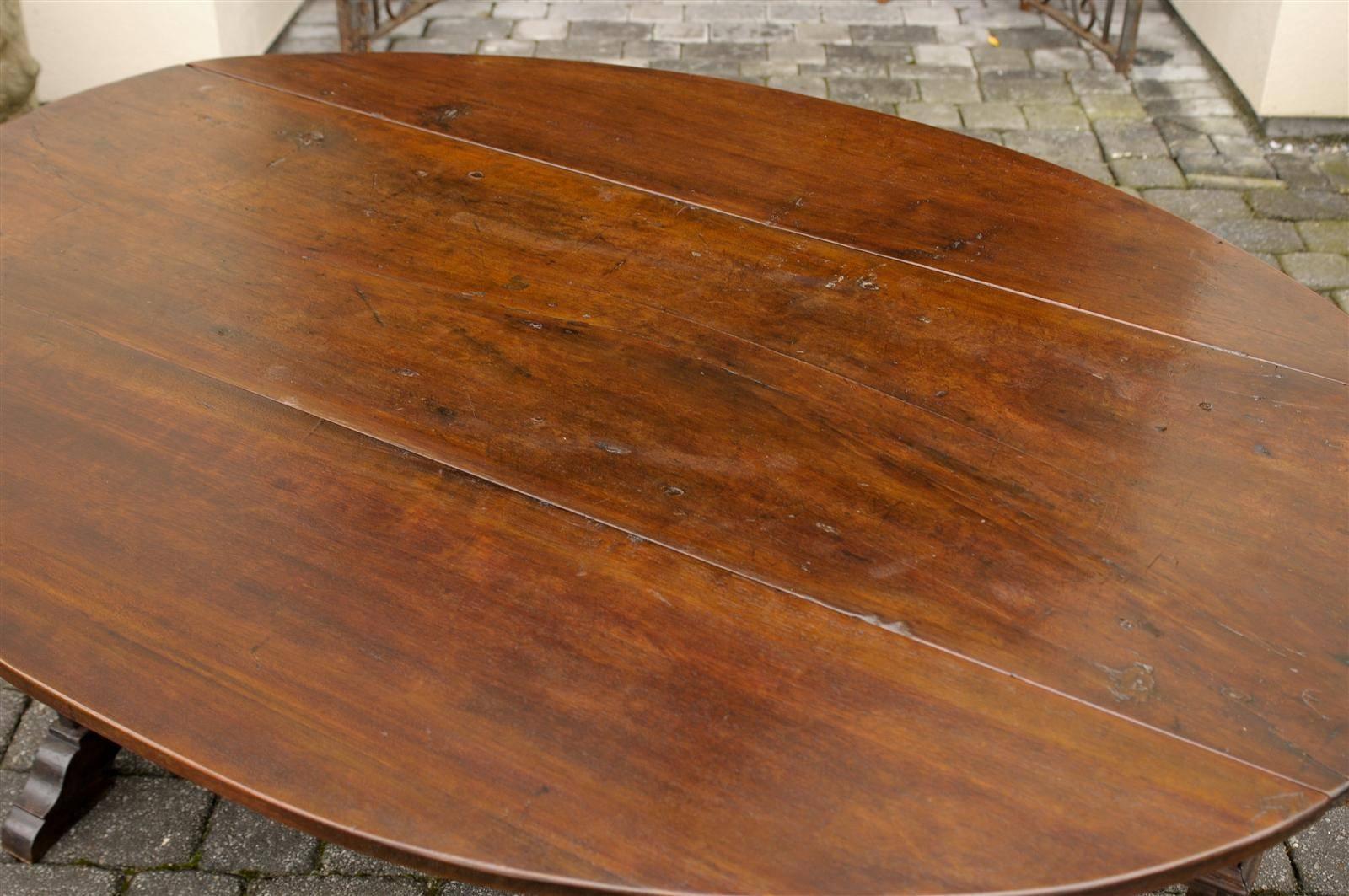 Wood Oval Italian Walnut Drop-Leaf Table from the Late 18th Century with Trestle Base
