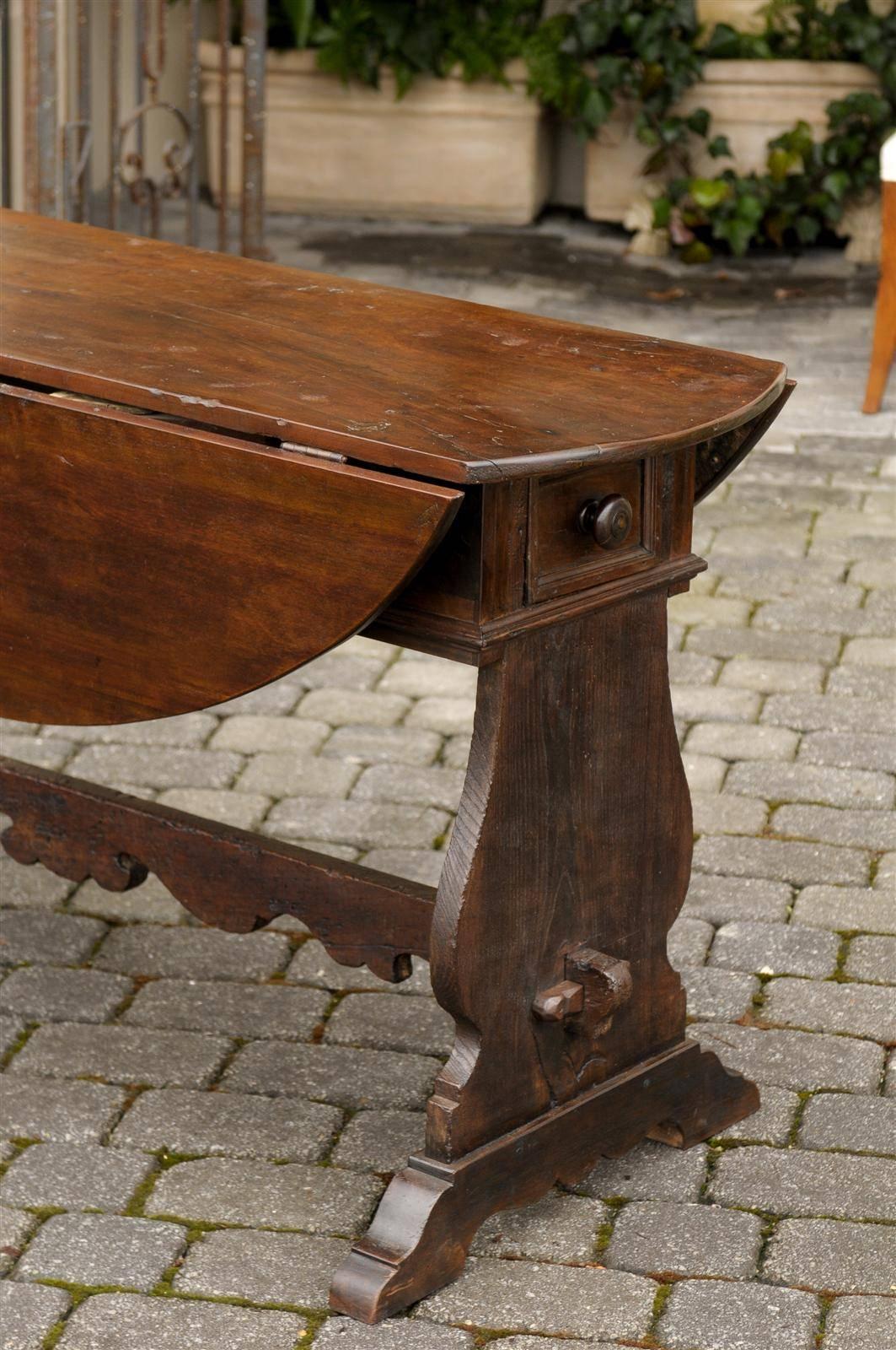 Oval Italian Walnut Drop-Leaf Table from the Late 18th Century with Trestle Base 1