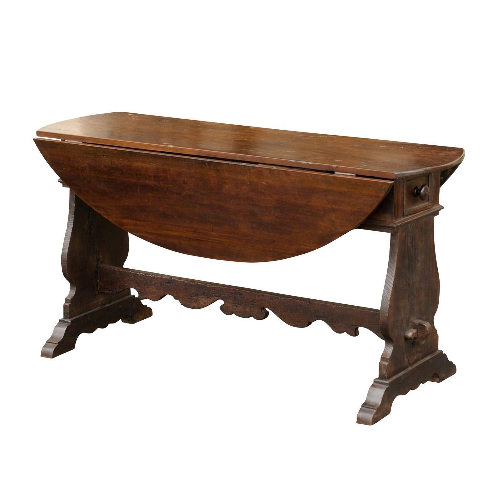 Oval Italian Walnut Drop-Leaf Table from the Late 18th Century with Trestle Base