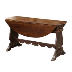 Oval Italian Walnut Drop-Leaf Table from the Late 18th Century with Trestle Base