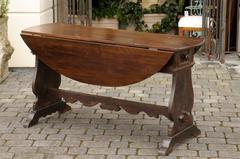 Oval Italian Walnut Drop-Leaf Table from the Late 18th Century with Trestle Base