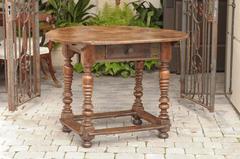 Oval French Early 19th Century Walnut Table with Stretcher and Single Drawer