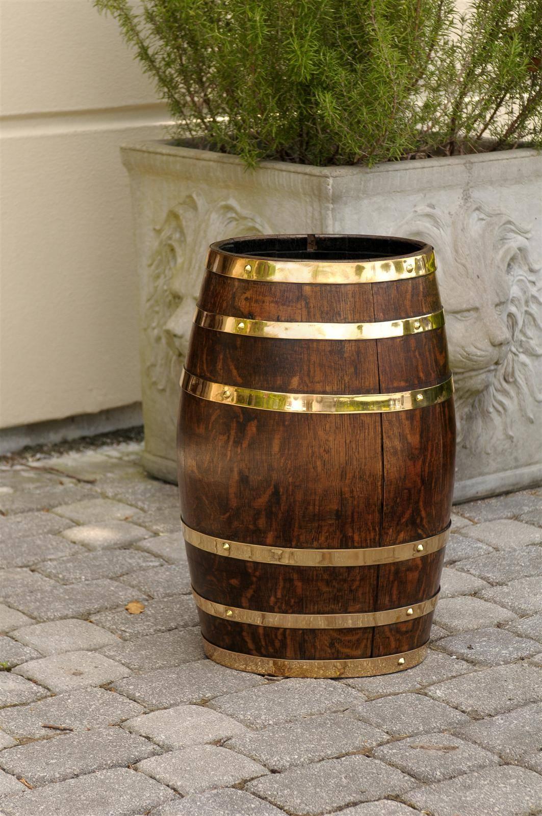 English oak barrel stick stand with brass trim.