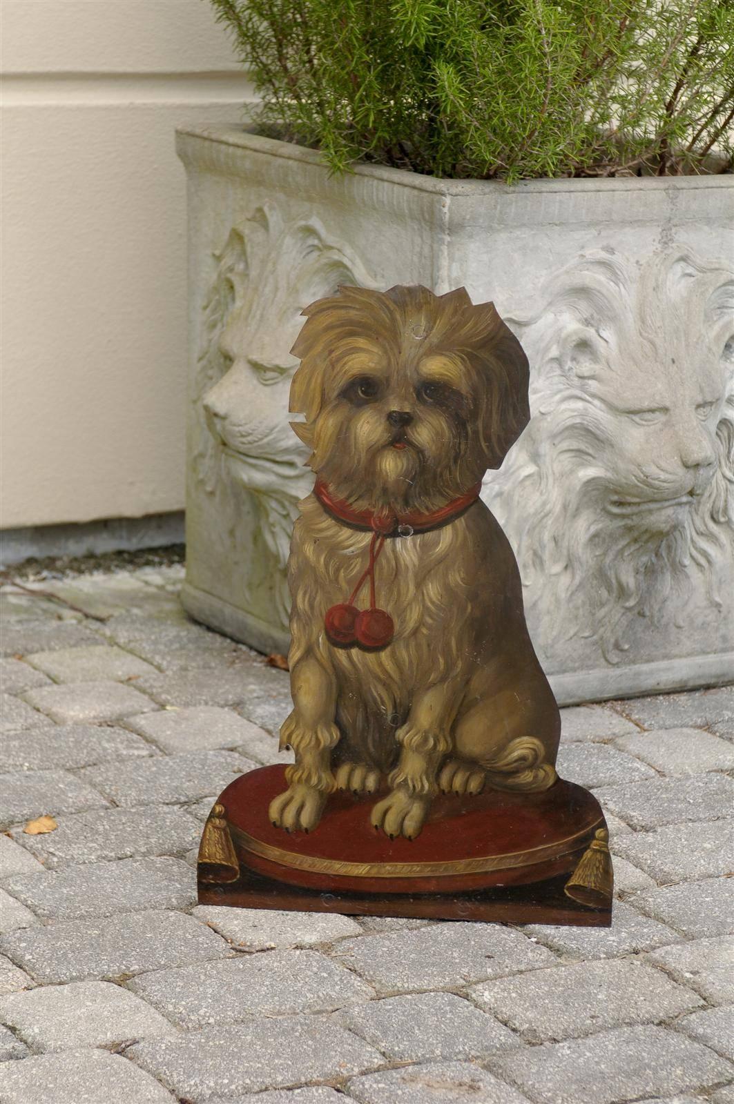 An English tole umbrella stand featuring a wonderfully painted terrier. This painted tole umbrella stand displays on its face a pleasant trompe l’œil style terrier, a traditionally popular dog in England. The dog is painted with numerous details
