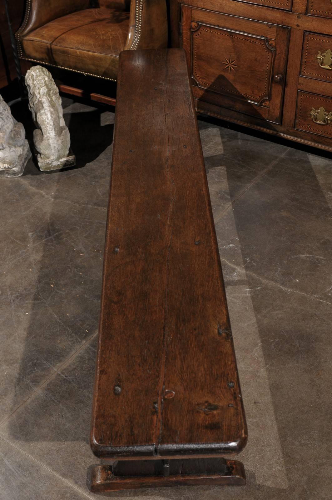 19th Century 1880s English Rustic Long Wooden Bench with Trestle supports and Stretcher