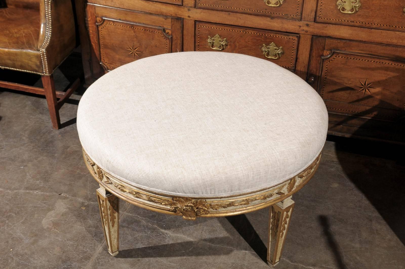Italian Neoclassical Style Upholstered Round Ottoman with Giltwood Motifs 1