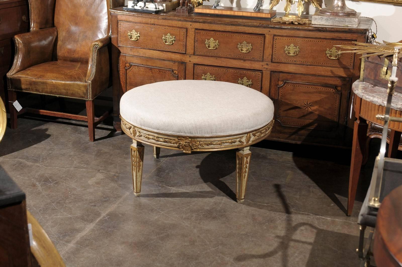 Painted Italian Neoclassical Style Upholstered Round Ottoman with Giltwood Motifs