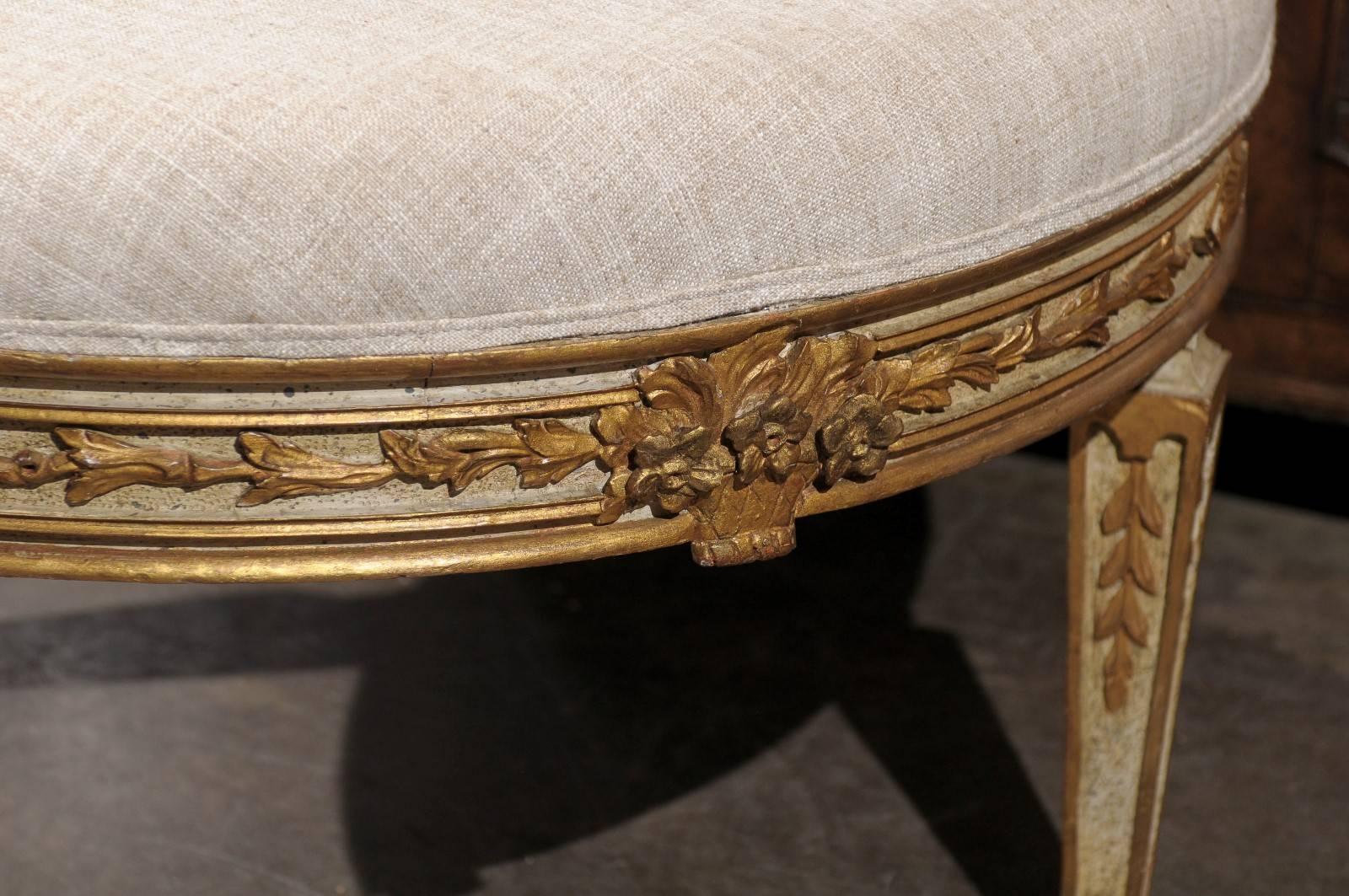 Italian Neoclassical Style Upholstered Round Ottoman with Giltwood Motifs 2