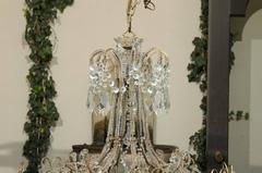 Large Italian 1920s Crystal Gilt Metal Eight-Light Chandelier with Scrolled Arms