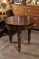 Mid 19th century English Mahogany Round Table Raised on Three Turned Legs
