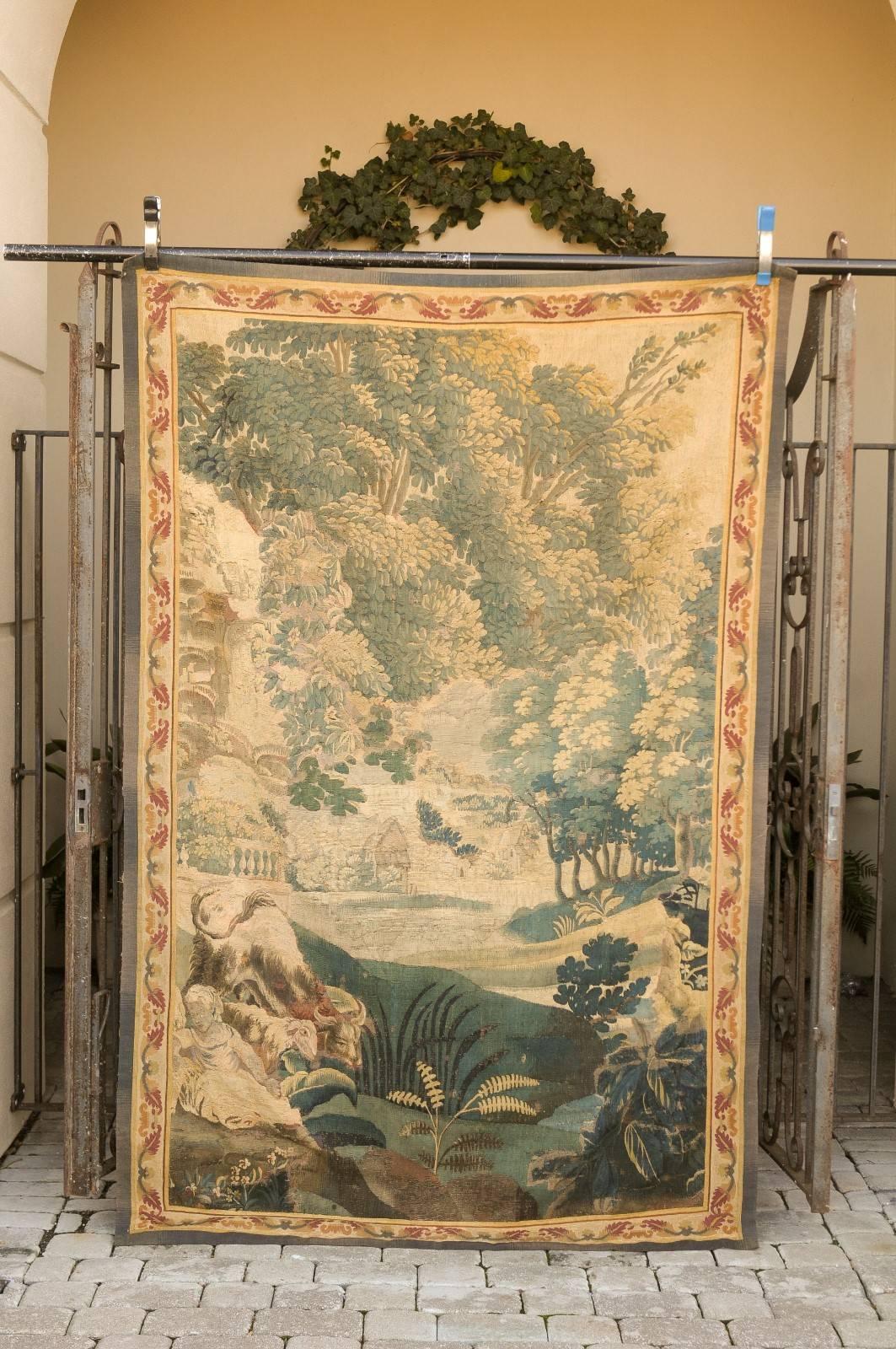 A French Aubusson early 19th century vertical tapestry with pastoral scene. Immerse yourself in the tranquil beauty of rural France with this early 19th-century French Aubusson tapestry, elegantly crafted to portray a serene pastoral scene. This