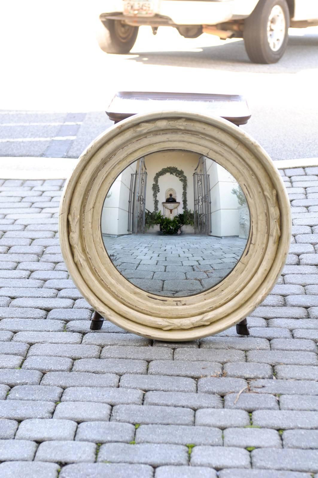 English wood carved round convex mirror, gilt worn off, gesso sealed.