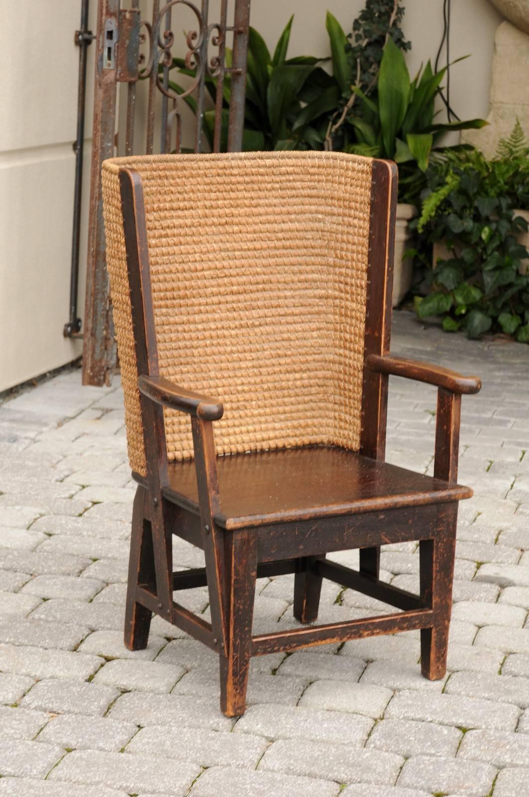 An Orkney accent chair from the mid-19th century. This wood and straw chair, circa 1860 comes from the Orkney Islands near the northern tip of Scotland. Produced in the 1800s-early 1900s, these stylistically very recognizable chairs feature a wooden