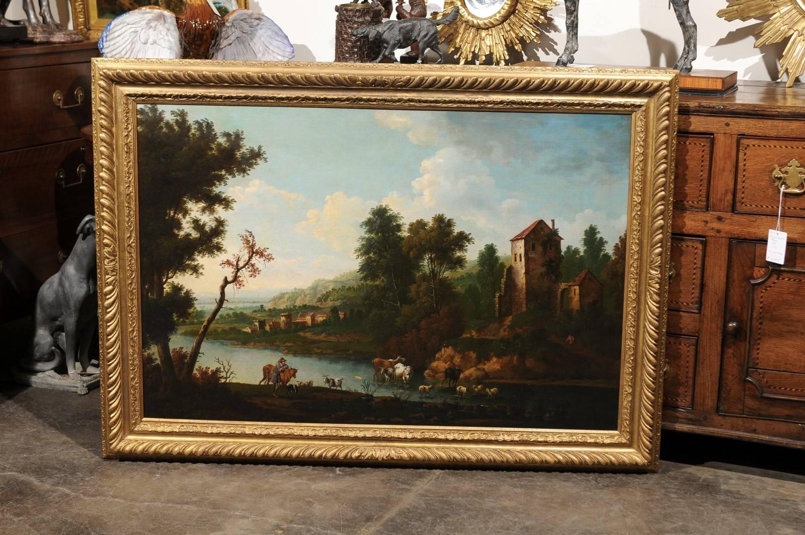 An English early 19th century painting of the Italian countryside. This English painting depicts a traditional scene of animals in a country setting. The careful composition places two trees close to the center of the piece while another set of