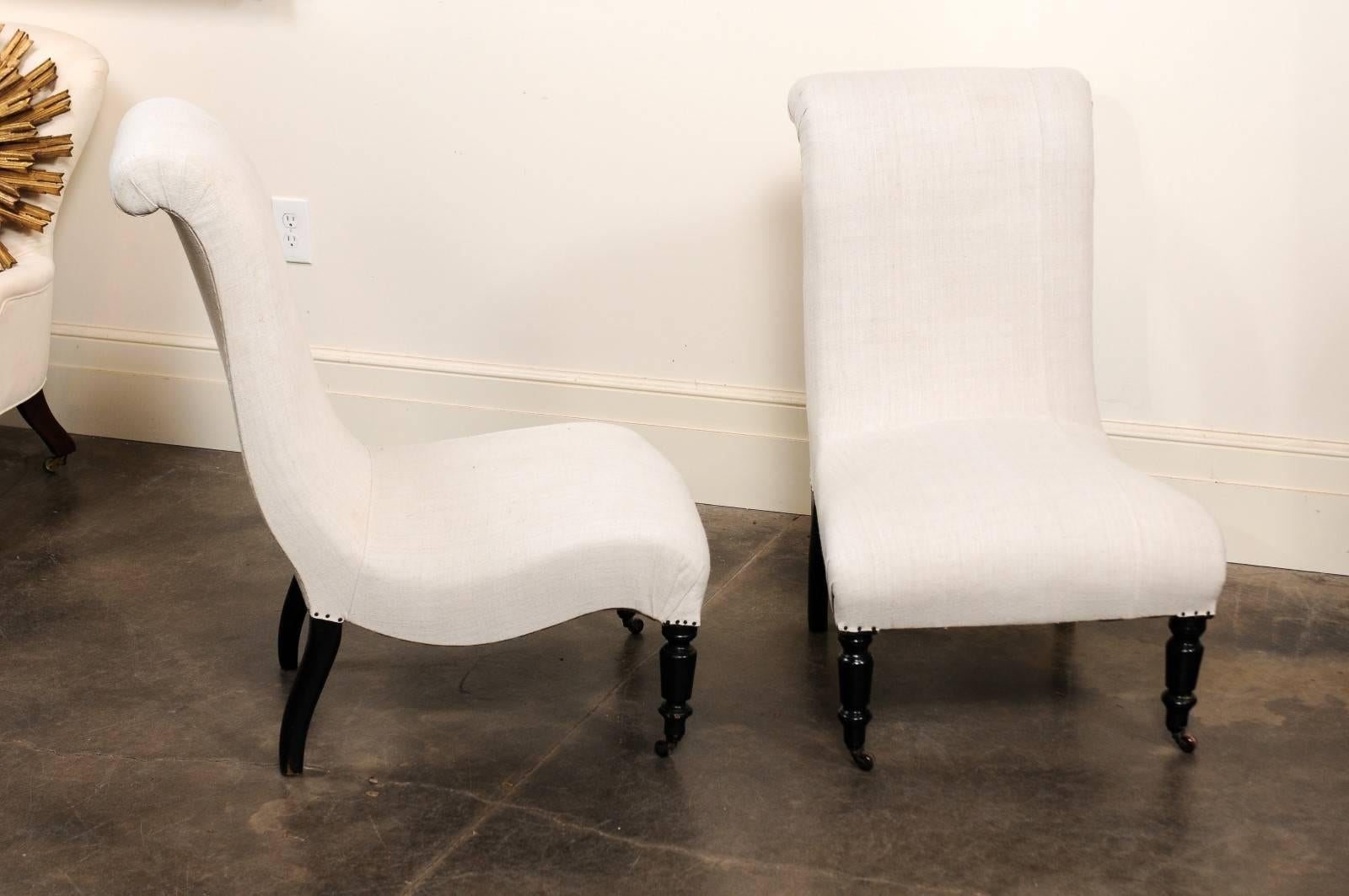 Muslin Pair of English Upholstered and Ebonized Wood Slipper Chairs, circa 1900