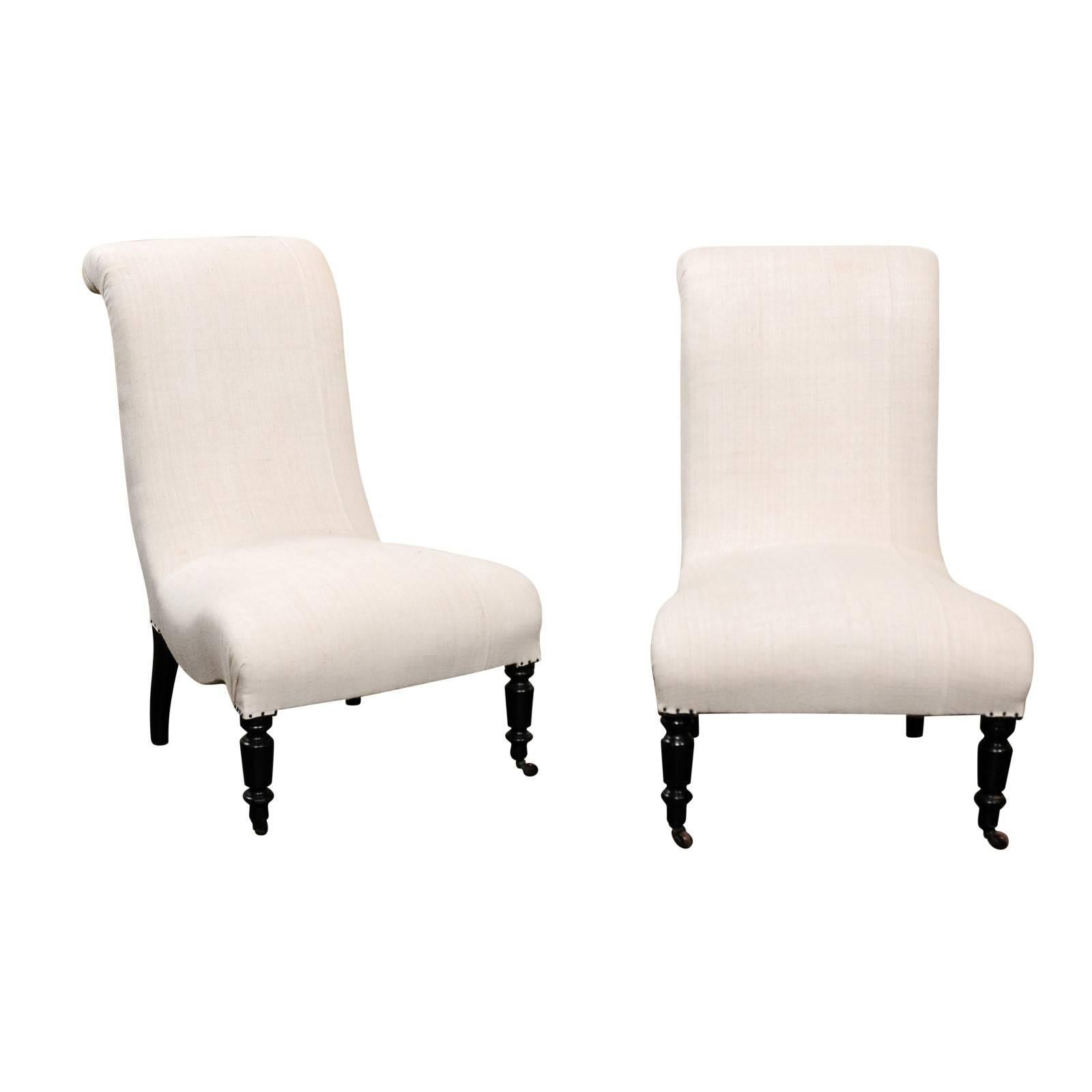 Pair of English Upholstered and Ebonized Wood Slipper Chairs, circa 1900