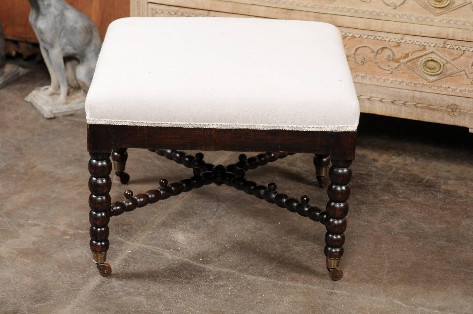 English Bobbin Leg Upholstered Ottoman with Unusual Cross Stretcher, circa 1880 In Excellent Condition In Atlanta, GA