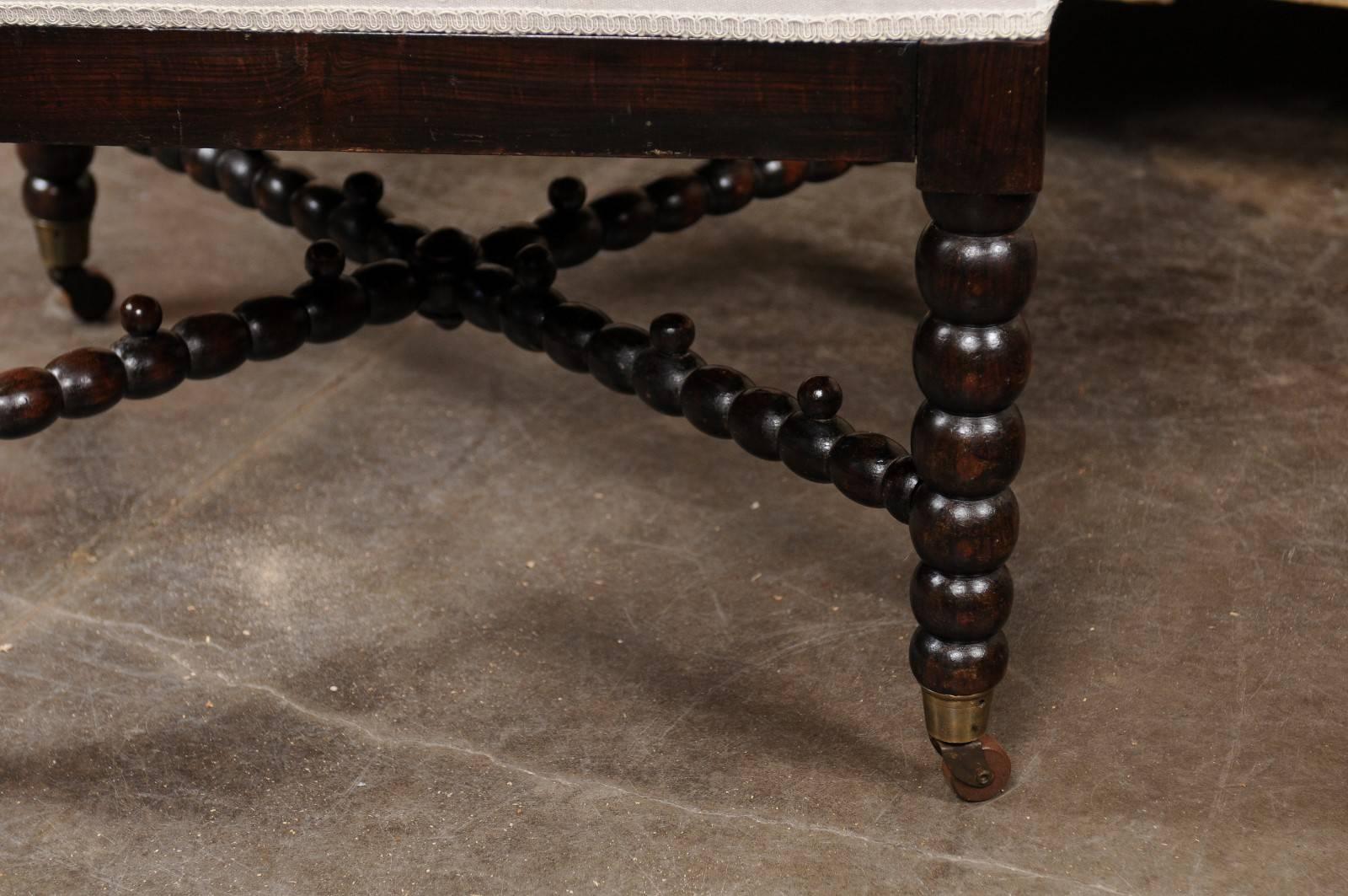 19th Century English Bobbin Leg Upholstered Ottoman with Unusual Cross Stretcher, circa 1880