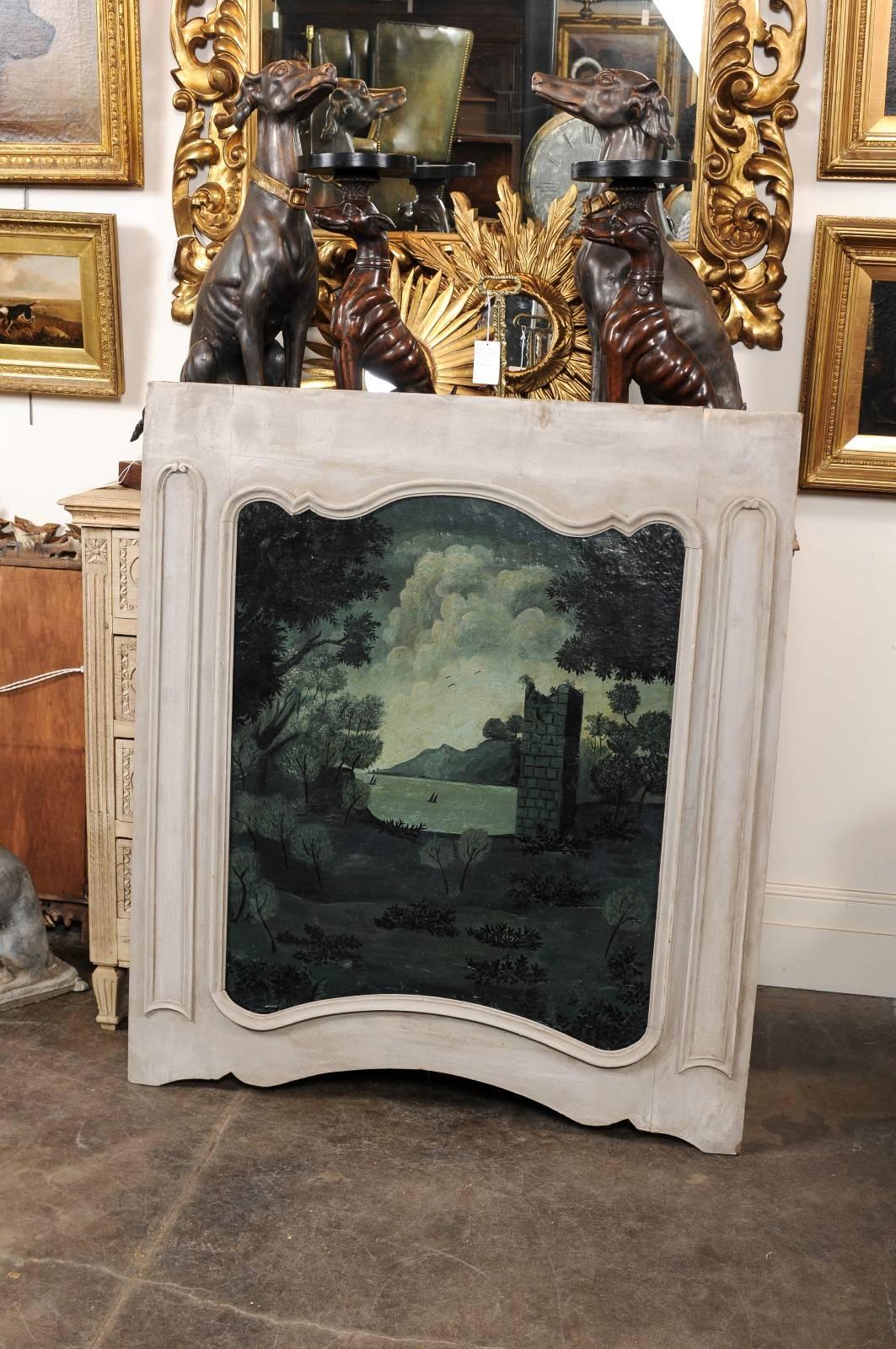 This French trumeau painting from the late 19th century features a beautifully executed painted scene on canvas, reminiscent of a technique situated between the grisaille or the verdaille. The viewer immediately focuses on the ruined construction