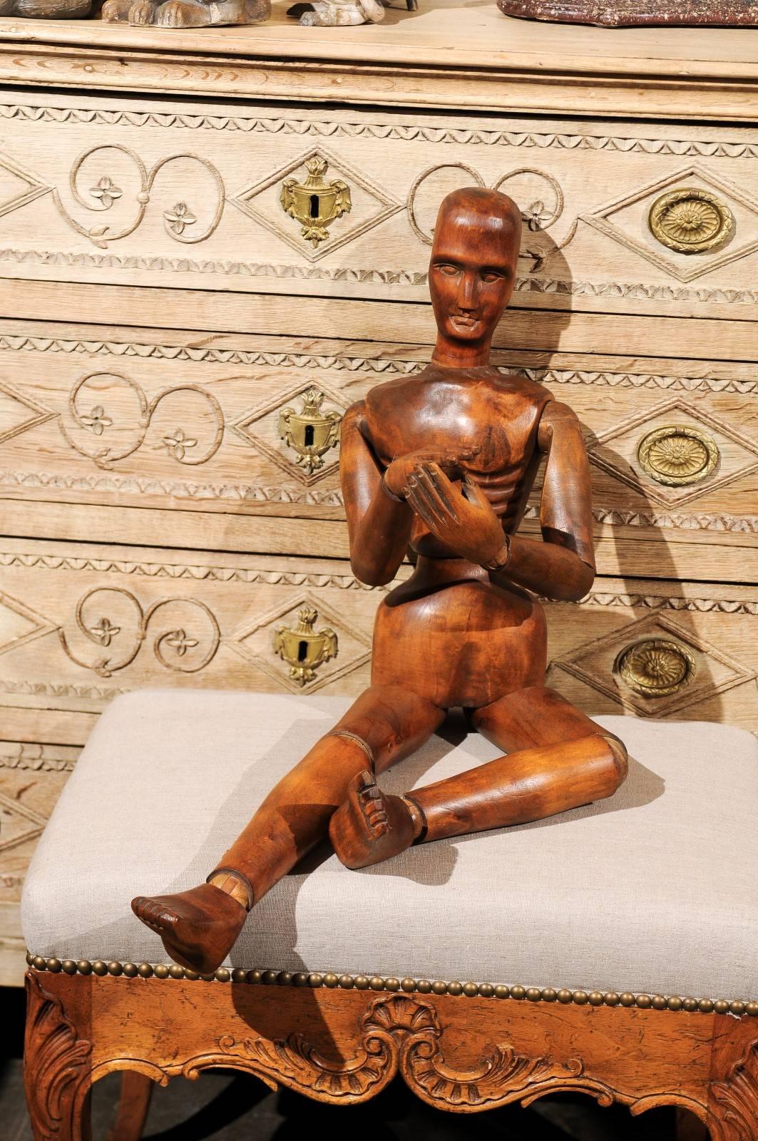 English artist's wooden articulated mannequin from the early 20th century. This piece is reminiscent of the practice, common during the Renaissance, of artists using mannequins as models. The stillness provided by the articulated mannequins allowed