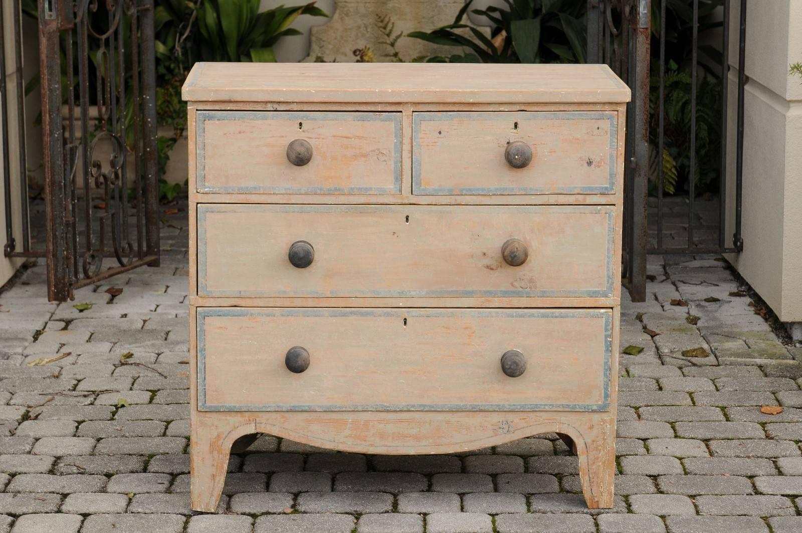 An English painted wood four-drawer chest from the mid-19th century with original paint. This English wooden commode, circa 1840 features a rectangular top over four dovetailed drawers. The upper section showcases two smaller drawers placed above